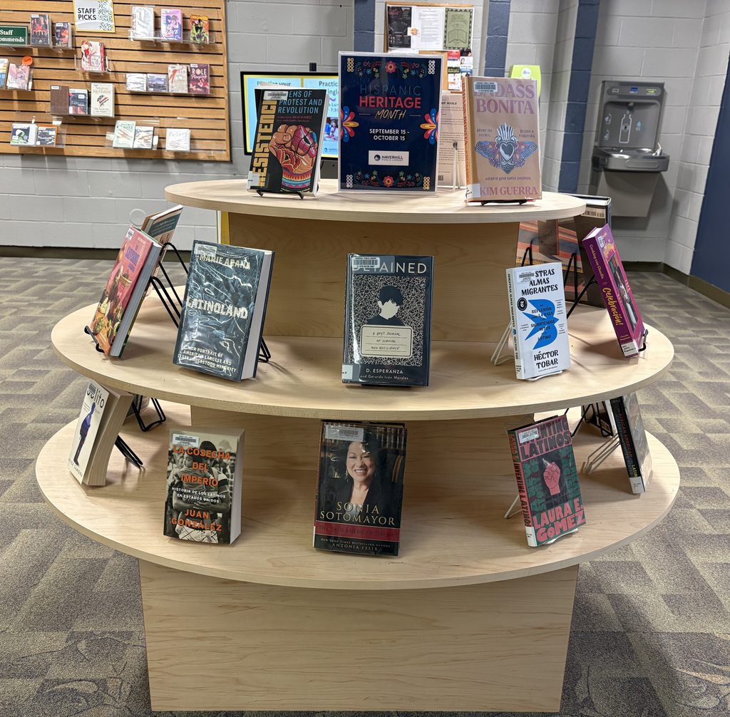 Books on display with sign at the top saying "Hispanic Heritage Month September 15 - October 15"
