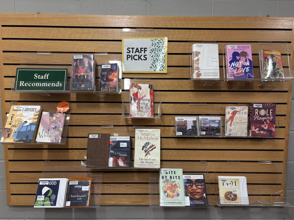Staff Picks wall with books on display